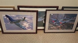 Framed photographs of reconditioned WWII bomber planes