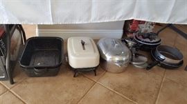 roasting pans and gently used pots and pans - be sure to look under the tables, lots to see! 