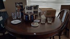 pub height table with chairs and checkerboard/chess table, lots of games and bar sets