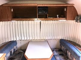1998  Airstream  Bambi Camper- inside view of dinette nook with upper cabinet storage