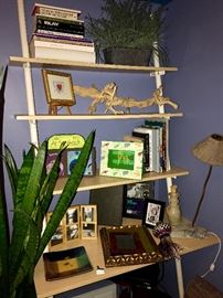 Slated bookshelf, pictures frames, books and other items