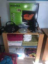 Insignia HDTV , Towels, Radio and Headphones. 