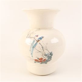 Hand-Painted Off-White Vase: An off-white ceramic vase with a hand-painted design. This vase has a flared mouth and sloping shoulders. It has a design of blue birds in a flowering tree.