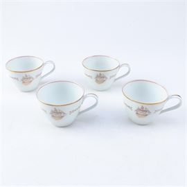 Noritake Porcelain Teacups: A set of Noritake porcelain teacups. Offered are four teacups with a gilt sail ship motif. The pieces are marked “Noritake Japan”.