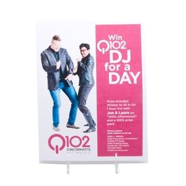 Win a Day with the DJs Jon and Laura: A certificate that guarantees the winning bidder a day with the fabulous Q102 disc jockeys Jon and Laura. The document states that the winner gets to “sit in for 1 hour live with Jon & Laura on ‘Q102 Afternoons!’ and a Q102 prize pack”.