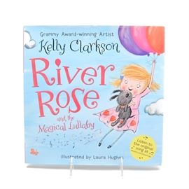 Kelly Clarkson Signed Children's Book: A Kelly Clarkson autographed children’s book titled River Rose and the Magical Lullaby. Kelly wrote this book motivated by her daughter River Rose. It’s about River Rose’s trip to the zoo. This book was a New York Times Best Sellers list for Children’s books in 2016. Kelly signed the title page with a black marker. This native Texan was the winner on American Idol’s inaugural year, 2002. She’s had three number one hits and seven top ten hits on the Billboard charts. Q102 obtained the signature at an event; paperwork is included.