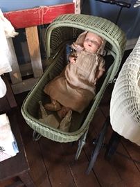 Antique doll & wicker stroller