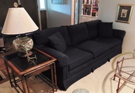 Benchmark couch; nest of two tables