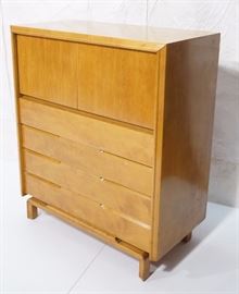 Lot 299 EDMUND SPENCE Blond Wood Tall Dresser raised on 