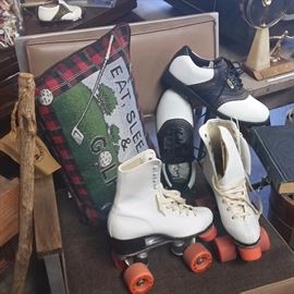 Office Chair with
Roller Skates size 7
Golf Shoes size 8 next to a 
Hill Billy Putter 

