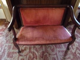 Antique setee with nailhead trim