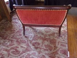 Antique setee with nailhead trim