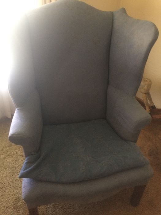  An American Upholstered Wingback Armchair