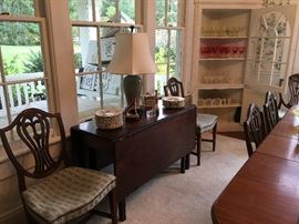 Fine antique drop-leaf table with a stack of Copeland Spode Charles Dickens character plates and a stack of ruffled butterfly plates--now we know where Portmeiron got the idea for mixing and  matching botanicals.