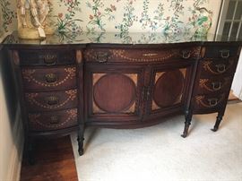 Beautifully inlaid side board for all your dining needs.