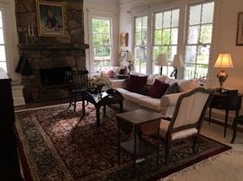 A long view of the living room on a fine hand-knotted rug from the Furniture Shop.