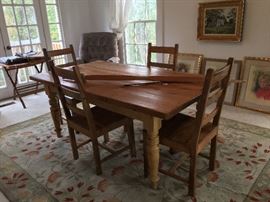 A fine farm table and chairs from Ana Woodworks.  A handmade bow can make an arrow sing.