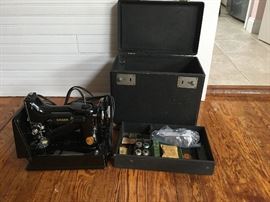 Singer Featherweight machine in working condition and with all attachment.  Case only shows wear.
