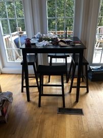Pottery Barrel table and four stools.