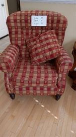 Two accent chairs with palm tree pattern. Chair reclines.