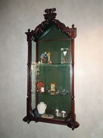 BAT:  Exceptionally fine & rare Austrian carved mahogany wall-hanging vitrine with glazed side doors and full turned columns.  Circa 1880s.  64.75" x 29" x 14.5"