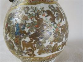 Note the "emperor" monkey with arms overhead wearing a blue and gilt kimono.