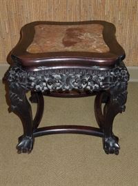 CW:  Choice Chinese rosewood low table with rouge marble inset top.  Apron elaborately pierce-carved with floral scrollwork (forgive the dust) on stout incurved legs with claw feet joined by a concave stretcher.  Circa 1890. 