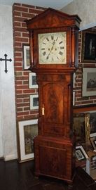 BAT:  Scottish mahogany longcase clock of unusually fine proportions with matched crotch veneers;  atypical molded triangular pediment, full turned and ringed bonnet columns, broad waist with arch-top door, paneled base on bracket feet.  Square painted iron dial with gilt spandrels enclosing polychrome floral decor signed "Thos. (Thomas) Yates, Preston"  Robust eight-day movement striking on a cathedral gong, calendar and seconds bit.  Circa 1860.   86.5" h., 24.25" w., 10.5" d.  Overall fine original condition and running order.  Exceptional color and patina.