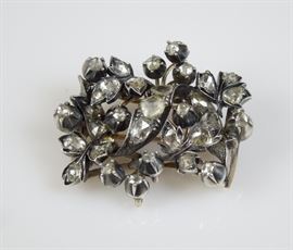 Georgian Brooch; European mine and rose-cut diamonds set in silver-cup mounts atop a 14K yellow gold backing.  Approx. 4.5 carats total weight.   32.3mm x 28.6mm.  Circa late 18th century.    