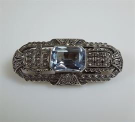 Art Deco Silver, marcasite and faceted pale blue topaz brooch.  Circa 1920s.