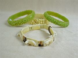 CW:  Carved celluloid bangles.  Inuit carved walrus tusk bracelet.