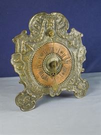 BAT:   Fine 18th century German shelf clock with crown wheel escapement and "cowtail" pendulum.  Embossed brass front with copper chapter ring. 