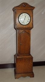 BAT:   Miniature British oak longcase clock with fired enamel dial,  8-day French movement.  Circa 1910