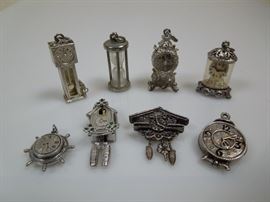 BAT:  Sampling of Barbara Tomsky's vast collection of sterling silver figural and novelty charms.  Clock motifs!