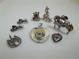 BAT:  Sampling of Barbara Tomsky's vast collection of sterling silver figural and novelty charms.