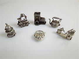 BAT:  Sampling of Barbara Tomsky's vast collection of sterling silver figural and novelty charms.