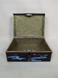 Gold silk brocade lined interior.