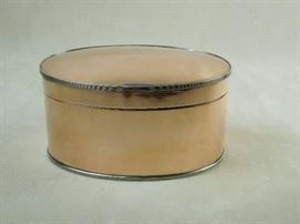 BAT:  Elegant copper tea caddy of rare domed oval form with reeded silver rims.    Top with box hinge.   English, circa 1890.