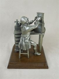 BAT:  Detailed Worcester Pewter limited edition sculpture - Colonial clockmaker at his bench.  Walnut plinth.  Circa 1976. 