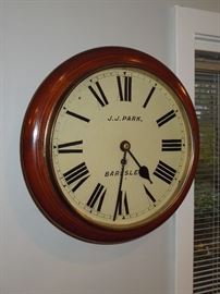 BAT:  Choice British mahogany gallery or "dial" clock with robust 8-day chain fusee movement.  Well preserved painted dial with merchant's name and city, blued steel hands, brass bezel.  Quality cabinetry with warm color and patina.  Circa 1890.  12" dial.  Running order.  