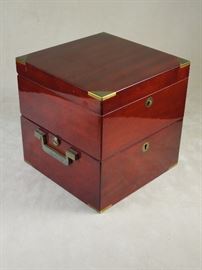 Elegant brass bound double-section hinged mahogany cased "Marine Deck" timepiece by Matthew Norman, Switzerland.  Heavy cast brass gimbaled movement with 4.25" diameter bezel.  Crisp dial and steel hands. Circa 1985 - fine condition and perfect running order.  7" x 7" x 7" case 