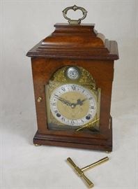 Elegant Elliott, London burr walnut bracket clock of unusual small size with hour/half-hour strike on bell.  Jeweled platform escapement.  Circa 1970.  Good running order.