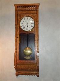 BAT:  Rare circa 1905 Ansonia (Brooklyn, NY and Ansonia, CT) "Santa Fe" model tandem weight 8-day regulator.  Exceptional oak case with spindle gallery crest and full turned columns flanking the door.  Refinished, dial professionally repainted.  46.5" h. x 16.5" w. x 8.5" d. 