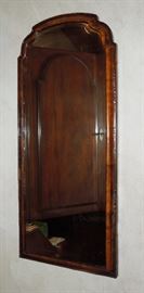 Queen Anne style bench-crafted English walnut mirror with shaped and beveled antique looking glass.  