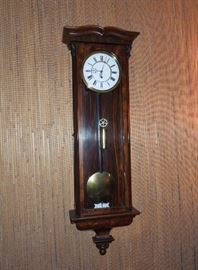 BAT:   Elegant single-weight Vienna regulator - drawn grain rosewood case of fine proportions  with double arch molded pediment.  Two-piece fired enamel dial, delicate cut steel hands  Fine original condition and running order.  Circa 1850. 