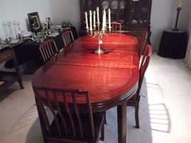Beautiful Mahogany dining room set with 6 chairs, 2 leaves, and custom table pads which were always used.