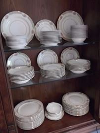 Beautiful fine china service for twelve plus additional serving pieces, note not all pieces are shown in this photo.