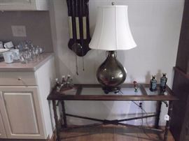 Designer Brass lamp, wood & glass sofa table, and misc. decorative pieces.