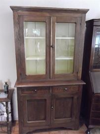 19 century "Step back" Cupboard. Solid wood 2 pieces in excellent shape for it's age.  This Antique piece will look great in any house.