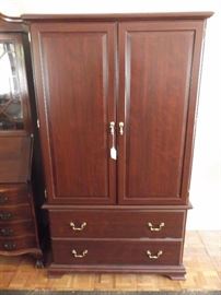 Nice storage piece, Pressed wood with brass handles. If you want an inexpensive storage piece that still has some style to it, this is the one.